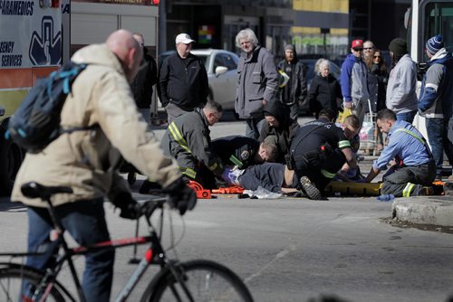 RUTH BONNEVILLE  /  WINNIPEG FREE PRESS

A man is taken away on a stretcher after being struck by a vehicle in the westbound lane of Portage Ave. at Donald Street Saturday afternoon.  Traffic was closed in the westbound lane for a time but two lanes next to the curb lane are now open.  


March 17, 2018