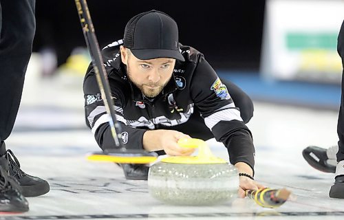 TREVOR HAGAN / WINNIPEG FREE PRESS
Skip Mike McEwen throws a rock on his way to winning the Grand Slam of Curling event as his rink defeated skip Brad Gushue, Sunday, March 18, 2018.