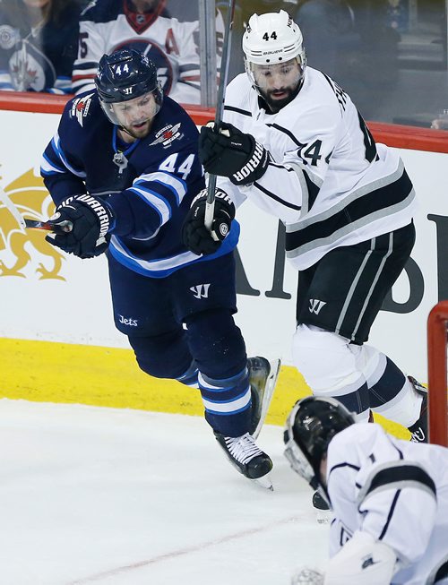 Winnipeg Jets' Josh Morrissey (44) attacks against Los Angeles Kings' Adrian Kempe (9) during first period NHL action in Winnipeg on Tuesday, March 20, 2018. THE CANADIAN PRESS/John Woods
