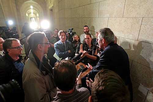 BORIS MINKEVICH / WINNIPEG FREE PRESS
Manitoba Premier Brian Pallister in scrummed by the media in a second floor hallway at the Manitoba Legislative Building. Re: Hydro board quitting. March 21, 2018