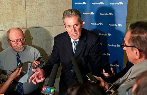 BORIS MINKEVICH / WINNIPEG FREE PRESS
Manitoba Premier Brian Pallister in scrummed by the media in a second floor hallway at the Manitoba Legislative Building. Re: Hydro board quitting. March 21, 2018