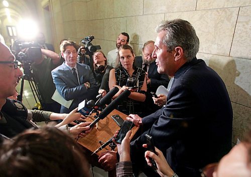 BORIS MINKEVICH / WINNIPEG FREE PRESS
Manitoba Premier Brian Pallister in scrummed by the media in a second floor hallway at the Manitoba Legislative Building. Re: Hydro board quitting. March 21, 2018