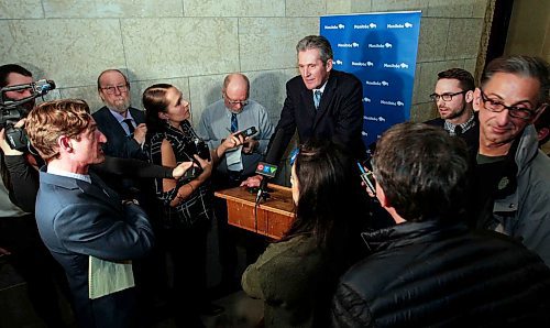 BORIS MINKEVICH / WINNIPEG FREE PRESS
Manitoba Premier Brian Pallister in scrummed by the media in a second floor hallway at the Manitoba Legislative Building. Re: Hydro board quitting. March 21, 2018