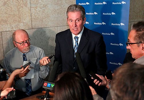 BORIS MINKEVICH / WINNIPEG FREE PRESS
Manitoba Premier Brian Pallister in scrummed by the media in a second floor hallway at the Manitoba Legislative Building. Re: Hydro board quitting. March 21, 2018