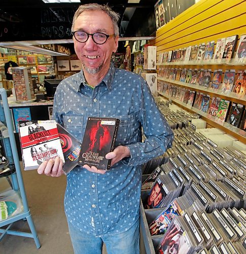 BORIS MINKEVICH / WINNIPEG FREE PRESS
Into the Music owner Greg Tonn poses for a photo in his store's  temporary movie section. Into the Music bought Music Trader/Movie Village just before Xmas and is now selling off the DVD collection in blowout sale, but keeping the music side at the new Osborne Village location. March 21, 2018
