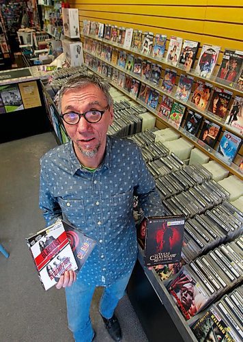 BORIS MINKEVICH / WINNIPEG FREE PRESS
Into the Music owner Greg Tonn poses for a photo in his store's  temporary movie section. Into the Music bought Music Trader/Movie Village just before Xmas and is now selling off the DVD collection in blowout sale, but keeping the music side at the new Osborne Village location. March 21, 2018