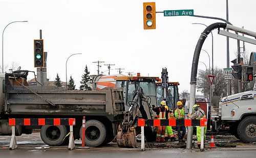 PHIL HOSSACK / WINNIPEG FREE PRESS - City repair crews block the northbound lanes of McPhillips Street at Leila ave. Wednesday as they repair a sinkhole that opened up Tuesday evening. Repairs are expected to block lanes for some time. (days) - March 21, 2018