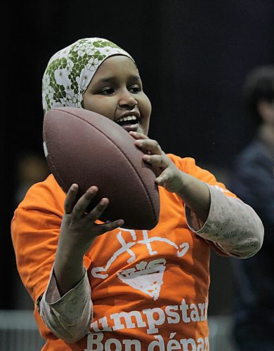 RUTH BONNEVILLE  /  WINNIPEG FREE PRESS

Shankaron Muse of Greenway School learns to throw a football during skills sessions at the RBC Convention Centre Thursday.  Over 160 local Jumpstart kids aged 9-12 years old from Greenway School and Victory School participated in football skills training led by 10 current CFL players.

Standup photo 


March 22,  2018