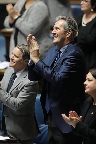 RUTH BONNEVILLE  /  WINNIPEG FREE PRESS

Premier Brian Pallister applauds the achievements of the Manitoba Women's Bison  Hockey Team for their championship win with his colleges  in the Legislature Thursday.  

March 22,  2018