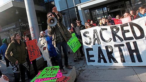 PHIL HOSSACK / WINNIPEG FREE PRESS - Peter Kulchyski rallied about a hundred protestors Thursday afternoon as a protest march gathered at Manitoba Hydro's Portage ave offices and prepared to walk to Thunderbird House. See Alex Paul's story.- March 22, 2018