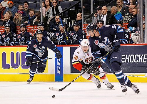 PHIL HOSSACK / WINNIPEG FREE PRESS - Stockton Heat #16 pursues Manitoba Moose #24 Cam Maclise in the mid zone while Moose #47 Charles-David Beaudoin follows at Bell MTS Place Thursday evening. - March 22, 2018