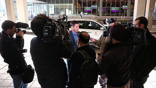 MIKE DEAL / WINNIPEG FREE PRESS
Mayor Brian Bowman arrives at the convention centre via ride share company, Tapp Car, prior to his big State of the City luncheon. 
180323 - Friday, March 23, 2018.