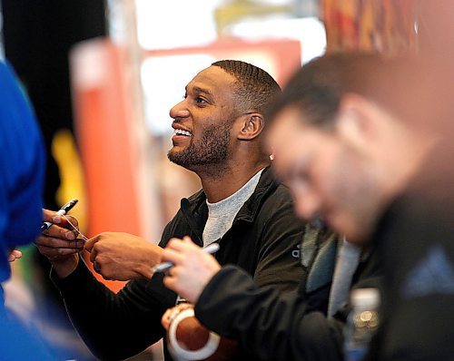 PHIL HOSSACK / WINNIPEG FREE PRESS - Adarius Bowman greets fans as he signs souvineirs at the CFL Week's Autograph session Friday afternoon. See story?.- March 23, 2018
