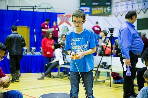 MIKAELA MACKENZIE / WINNIPEG FREE PRESS
Sam Heppner, 12, puts his robotic creation to the test at the annual Manitoba Robot Games at the Technical Vocational High School in Winnipeg on Saturday, March 24, 2018.
Mikaela MacKenzie / Winnipeg Free Press 24, 2018.