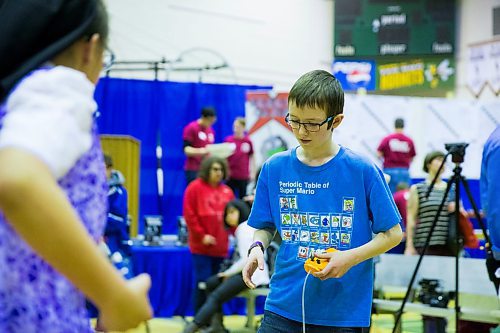 MIKAELA MACKENZIE / WINNIPEG FREE PRESS
Sam Heppner, 12, puts his robotic creation to the test at the annual Manitoba Robot Games at the Technical Vocational High School in Winnipeg on Saturday, March 24, 2018.
Mikaela MacKenzie / Winnipeg Free Press 24, 2018.