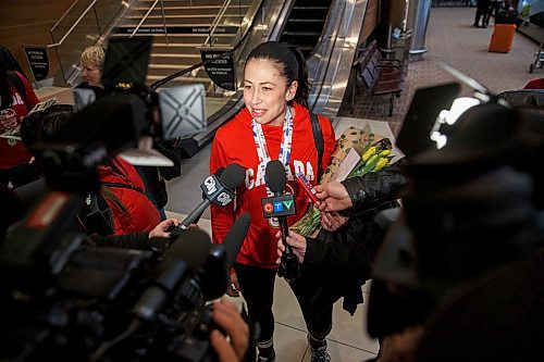 MIKE DEAL / WINNIPEG FREE PRESS
Jill Officer a member of the Jennifer Jones team that won the World Women's Curling Championship in North Bay, Ontario, arrives home to Winnipeg and is greeted by a legion of fans Monday afternoon.
180326 - Monday, March 26, 2018.