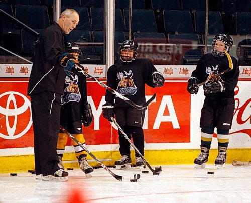 BORIS MINKEVICH / WINNIPEG FREE PRESS  081209 Dream Practice with the Moose- Players practice with 6-12 year olds that won this opportunity through a restaurant draw. Assistant coach Jay Wells works with the kids.