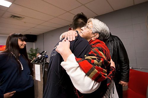 MIKAELA MACKENZIE / WINNIPEG FREE PRESS
Thelma Favel, Tina's great-aunt, hugs Joseph Ginter, a student who co-created a tribute in memory of Tina Fontaine that will stay in the Ndinawe Youth Resource Centre in Winnipeg on Tuesday, March 27, 2018.
Mikaela MacKenzie / Winnipeg Free Press 27, 2018.