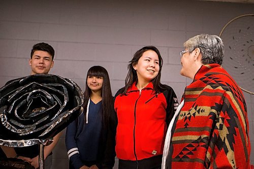 MIKAELA MACKENZIE / WINNIPEG FREE PRESS
Thelma Favel (right) and Sarah Fontaine share a moment while posing for pictures with Trinity Harry and Joseph Ginter before a funding announcement at the Ndinawe Youth Resource Centre in Winnipeg on Tuesday, March 27, 2018.
Mikaela MacKenzie / Winnipeg Free Press 27, 2018.