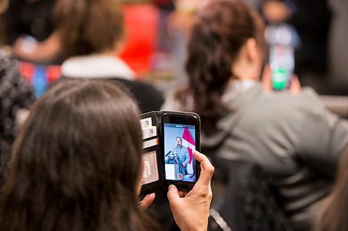 MIKAELA MACKENZIE / WINNIPEG FREE PRESS
Audience members film as Chief Kevin Hart speaks at a funding announcement supporting the Ndinawe Youth Resource Centre expansion in memory of Tina Fontaine in Winnipeg on Tuesday, March 27, 2018.
Mikaela MacKenzie / Winnipeg Free Press 27, 2018.