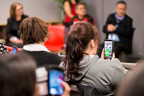 MIKAELA MACKENZIE / WINNIPEG FREE PRESS
Audience members film and livestream as Chief Kevin Hart speaks at a funding announcement supporting the Ndinawe Youth Resource Centre expansion in memory of Tina Fontaine in Winnipeg on Tuesday, March 27, 2018.
Mikaela MacKenzie / Winnipeg Free Press 27, 2018.