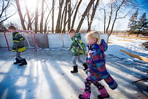 MIKAELA MACKENZIE / WINNIPEG FREE PRESS
Caleb (left), Adam, and Kyla Nobel walk out onto their backyard rink in Transcona in Winnipeg on Wednesday, March 28, 2018.
Mikaela MacKenzie / Winnipeg Free Press 28, 2018.