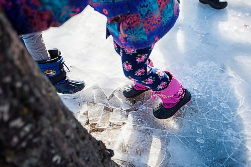 MIKAELA MACKENZIE / WINNIPEG FREE PRESS
The Nobel kids jump to crack ice layers on their backyard rink in Transcona in Winnipeg on Wednesday, March 28, 2018.
Mikaela MacKenzie / Winnipeg Free Press 28, 2018.