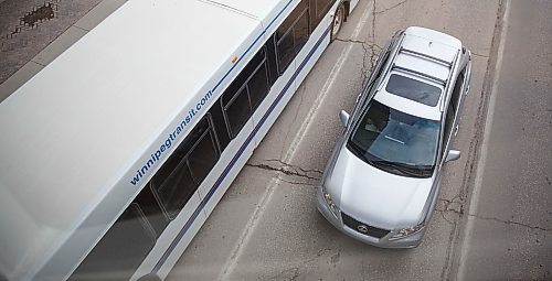 MIKE DEAL / WINNIPEG FREE PRESS
A Winnipeg Transit bus in downtown traffic.
180329 - Thursday, March 29, 2018.