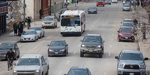 MIKE DEAL / WINNIPEG FREE PRESS
A Winnipeg Transit bus in downtown traffic.
180329 - Thursday, March 29, 2018.