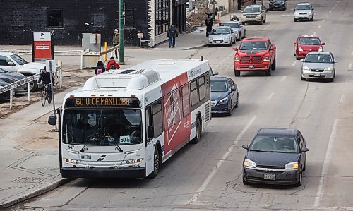 MIKE DEAL / WINNIPEG FREE PRESS
A Winnipeg Transit bus in downtown traffic.
180329 - Thursday, March 29, 2018.