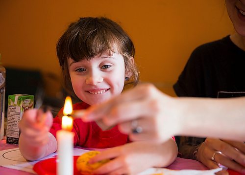 MIKAELA MACKENZIE / WINNIPEG FREE PRESS
Artis Gray, five puts her tool into the flame to melt the wax before drawing on her egg in a Pysanka (Ukrainian Easter egg) workshop held at the Westminister Housing Co-op in Winnipeg on Saturday, March 31, 2018.
Mikaela MacKenzie / Winnipeg Free Press 31, 2018.