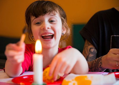 MIKAELA MACKENZIE / WINNIPEG FREE PRESS
Artis Gray, five puts her tool into the flame to melt the wax before drawing on her egg in a Pysanka (Ukrainian Easter egg) workshop held at the Westminister Housing Co-op in Winnipeg on Saturday, March 31, 2018.
Mikaela MacKenzie / Winnipeg Free Press 31, 2018.