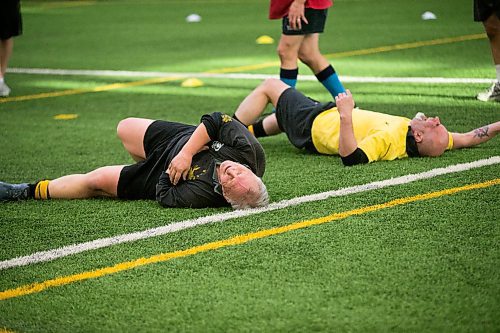 MIKAELA MACKENZIE / WINNIPEG FREE PRESS
Winnipeg Wasps Guy McKim (left) and Marc Pellerin laugh on the ground after a particularly bad crash during practice at the Axworthy Health & RecPlex in Winnipeg on Saturday, March 31, 2018. They are preparing for the 2018 Golden Oldies World Rugby Festival in Christchurch, New Zealand at the end of April.
Mikaela MacKenzie / Winnipeg Free Press 31, 2018.