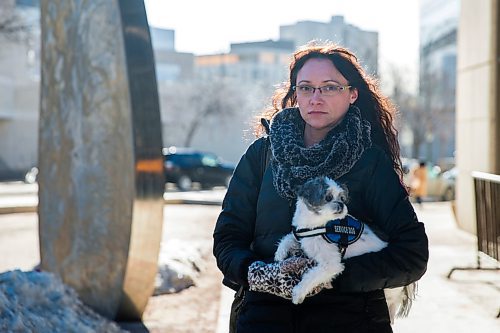 MIKAELA MACKENZIE / WINNIPEG FREE PRESS
Darya Omelchenko, who has gotten has gotten special permission to bring her therapy dog, peanut, into court with her pauses for a portrait on her way into the Law Courts in Winnipeg on Tuesday, April 3, 2018. Shes an immigration consultant, and is going to testify that she was physically assaulted by another immigration lawyer when she worked for him.
Mikaela MacKenzie / Winnipeg Free Press 03, 2018.