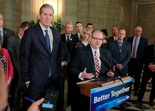 BORIS MINKEVICH / WINNIPEG FREE PRESS
Ambulance fees announcement in the Rotunda of the Legislative Building. From left, Premier Brian Pallister stands next to Health, Seniors and Active Living Minister Kelvin Goertzen, at podium, during the announcement. April 3, 2018