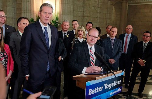 BORIS MINKEVICH / WINNIPEG FREE PRESS
Ambulance fees announcement in the Rotunda of the Legislative Building. From left, Premier Brian Pallister stands next to Health, Seniors and Active Living Minister Kelvin Goertzen, at podium, during the announcement. April 3, 2018
