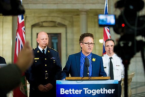 MIKAELA MACKENZIE / WINNIPEG FREE PRESS
Infrastructure Minister Ron Schuler announces the expansion of Alert Ready to wireless devices together with Manitoba RCMP Assistant Commissioner Scott Kolody (left) and Chief of Police Danny Smyth at the Manitoba Legislative Building in Winnipeg on Tuesday, April 3, 2018. 
Mikaela MacKenzie / Winnipeg Free Press 03, 2018.
