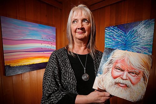 JOHN WOODS / WINNIPEG FREE PRESS
Winnipeg artist Faye Hall, holding a painting of English poet and Anglican chaplain Malcolm Guite, is photographed at the Mennonite Heritage Centre Gallery Tuesday, April 3, 2018. Hall has created a book and gallery show based on Guite's poem on Genesis 1. Her 63 paintings illustrating the book are on display now at the Mennonite Heritage Centre Gallery.