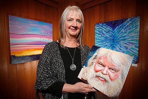 JOHN WOODS / WINNIPEG FREE PRESS
Winnipeg artist Faye Hall, holding a painting of English poet and Anglican chaplain Malcolm Guite, is photographed at the Mennonite Heritage Centre Gallery Tuesday, April 3, 2018. Hall has created a book and gallery show based on Guite's poem on Genesis 1. Her 63 paintings illustrating the book are on display now at the Mennonite Heritage Centre Gallery.