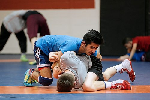JOHN WOODS / WINNIPEG FREE PRESS
Sam Pereira (grey) and Khaled Aldrar wrestle at Schewa Wrestling Tuesday, April 3, 2018. Pereira, Aldrar and some of their teammates are going to the nationals.