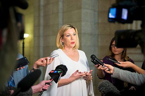 MIKAELA MACKENZIE / WINNIPEG FREE PRESS
Rochelle Squires, minister responsible for the status of women, scrums with the media on bill 219, which would prevent employers from requiring servers to wear high heels on the job, at the Manitoba Legislative Building in Winnipeg on Thursday, April 5, 2018. 
Mikaela MacKenzie / Winnipeg Free Press 2018.