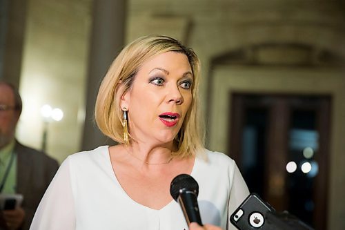 MIKAELA MACKENZIE / WINNIPEG FREE PRESS
Rochelle Squires, minister responsible for the status of women, scrums with the media on bill 219, which would prevent employers from requiring servers to wear high heels on the job, at the Manitoba Legislative Building in Winnipeg on Thursday, April 5, 2018. 
Mikaela MacKenzie / Winnipeg Free Press 2018.