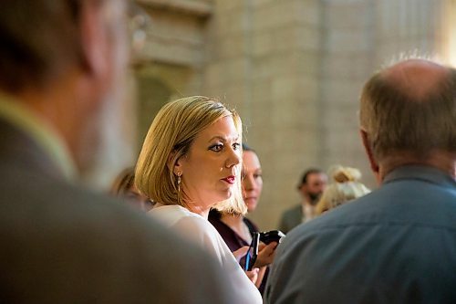 MIKAELA MACKENZIE / WINNIPEG FREE PRESS
Rochelle Squires, minister responsible for the status of women, scrums with the media on bill 219, which would prevent employers from requiring servers to wear high heels on the job, at the Manitoba Legislative Building in Winnipeg on Thursday, April 5, 2018. 
Mikaela MacKenzie / Winnipeg Free Press 2018.