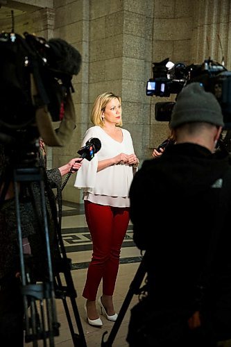 MIKAELA MACKENZIE / WINNIPEG FREE PRESS
Rochelle Squires, minister responsible for the status of women, scrums with the media on bill 219, which would prevent employers from requiring servers to wear high heels on the job, at the Manitoba Legislative Building in Winnipeg on Thursday, April 5, 2018. 
Mikaela MacKenzie / Winnipeg Free Press 2018.