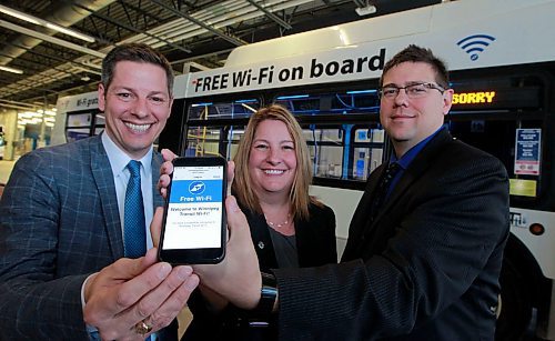 BORIS MINKEVICH / WINNIPEG FREE PRESS
Mayor Brian Bowman, Councillor Cindy Gilroy, Chair of the Standing Policy Committee on Innovation, and Michael Legary, Chief Innovation Officer pose for a photo in front of one of one of the new Free Wi-Fi on board busses at the bus station south Osborne (Brandon Ave.). JESSICA BOTELHO STORY. April 5, 2018