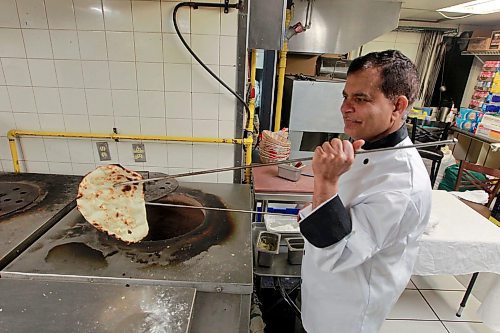 BORIS MINKEVICH / WINNIPEG FREE PRESS
Ivory Restaurant, 141 Donald St.   Parkash Choudhary makes a Nan Bread in the kitchen of the new location. This is for a Sunday This City column touching on the recent move by Ivory from its long-time digs on Main Street, to a new location on Donald Street. Dave Sanderson Story. April 4, 2018