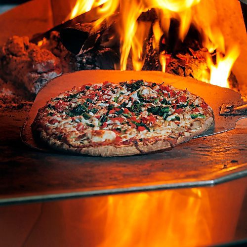 PHIL HOSSACK / WINNIPEG FREE PRESS - A "California" pizza comes out of the wood fired oven at Santa Ana pizzeria.....re:Munch Madness finalist.....See story. April 5, 2018