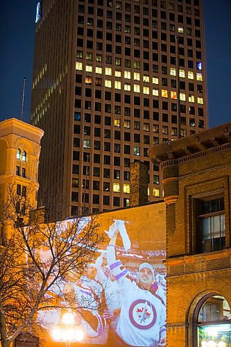 MIKAELA MACKENZIE / WINNIPEG FREE PRESS
Jets fan photos projected onto downtown buildings in Winnipeg on Thursday, April 5, 2018. 
Mikaela MacKenzie / Winnipeg Free Press 2018.