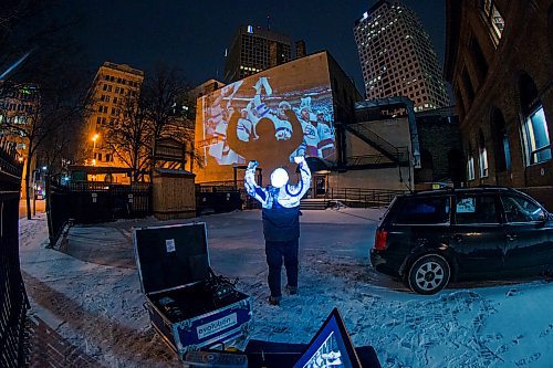 MIKAELA MACKENZIE / WINNIPEG FREE PRESS
Jets fan photos projected onto downtown buildings in Winnipeg on Thursday, April 5, 2018. 
Mikaela MacKenzie / Winnipeg Free Press 2018.