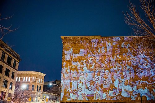 MIKAELA MACKENZIE / WINNIPEG FREE PRESS
Jets fan photos projected onto downtown buildings in Winnipeg on Thursday, April 5, 2018. 
Mikaela MacKenzie / Winnipeg Free Press 2018.